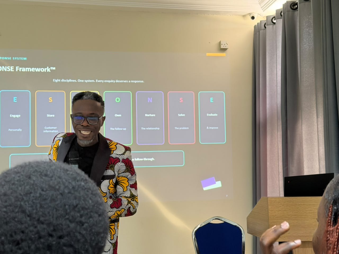 Bernard leading a customer response training session