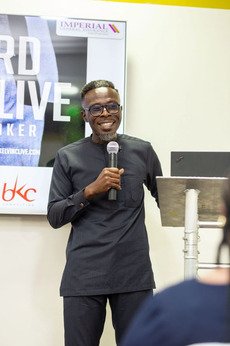 Bernard Kelvin Clive smiling while facilitating a corporate session